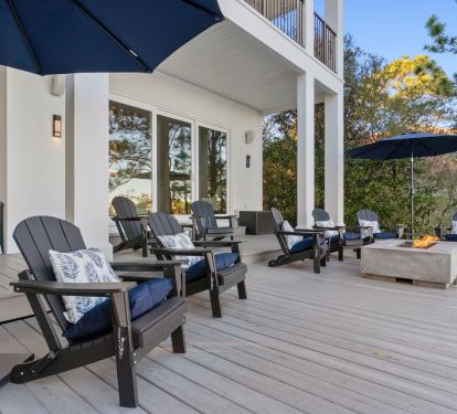 Spacious backyard with seating and a fire pit