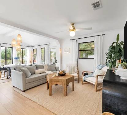 Living Room open to the dining and kitchen. Sonos speaker &amp; large tv
