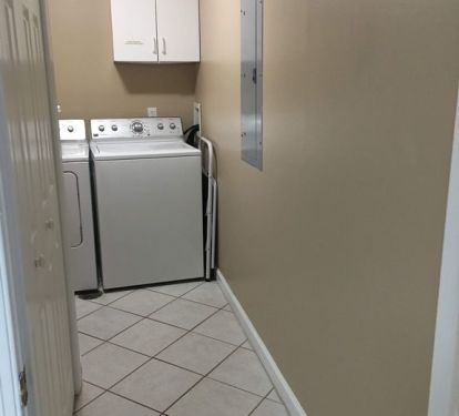 Laundry room with full sized washer and dryer