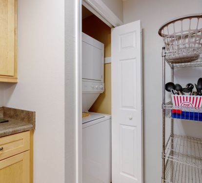 Laundry facilities and extra shelving.