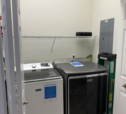 Downstairs Laundry with Full Size Washer and Dryer