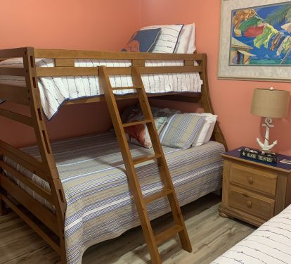 Guest bedroom with two twins and full size twin beds.