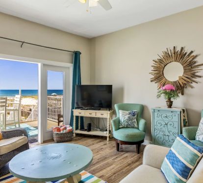 Main living area with beach views and HD TV, cable channels provided!!