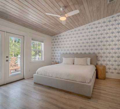 Primary Suite 1 with luxurious king bed and private deck