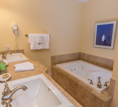 Master bath with dual sinks and jetted whirl pool tub