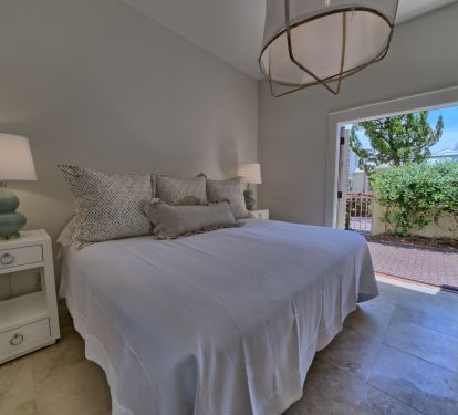 First Floor Master Bedroom with french doors to private courtyard.
