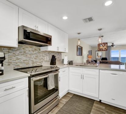Full views of the living and dining areas from the kitchen.