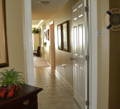 hallway leads to living and kitchen - behind is lock out suite w/ kitchenette