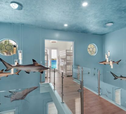 Aqua-15 Glass balcony rails create an underwater feel as you pass circling sharks.