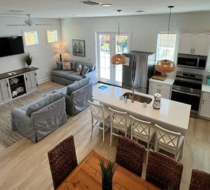 Elevated view of the great area with great spaces to dine or lounge! Complete with quartz countertops, two large refrigerators and a separate ice maker within the island!