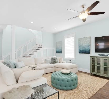 Breeze-5 Comfy designer seating with large flat screen tv creates an equally awesome space for both family convos and movie nights.