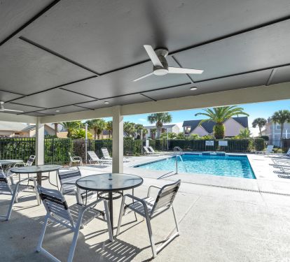 Covered seating and restrooms at the community pool.  