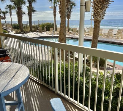 RELAX in the HI-Boy Chairs looking over the railing at the pool and Gulf waves.