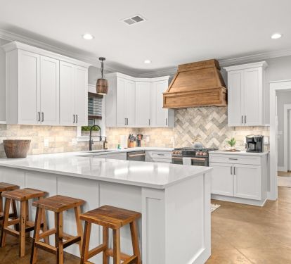 High End GE Cafe Appliances in this Chef's Kitchen. Gas stove, Double oven