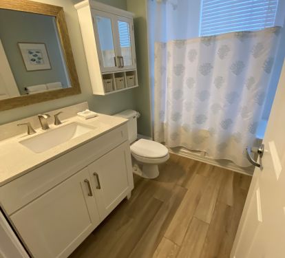 Bathroom 3-  Plenty of storage, tub/shower has window with gulf views.