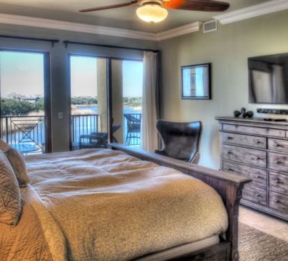 Southwest Master Suite with view of beach, Gulf and big Redwish Lake