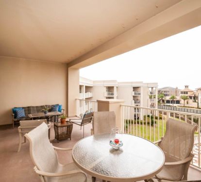 Our 350 sq. ft balcony overlooking the pool, natural pond and Gulf of Mexico