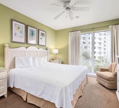Guest King bedroom with floor to ceiling windows and gulf view