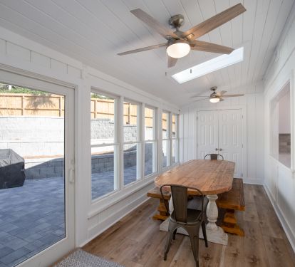 Enjoy family meals together at the large dining table overlooking the pool/patio area.