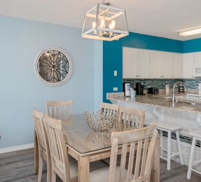 Dining area seats six - plus three barstools