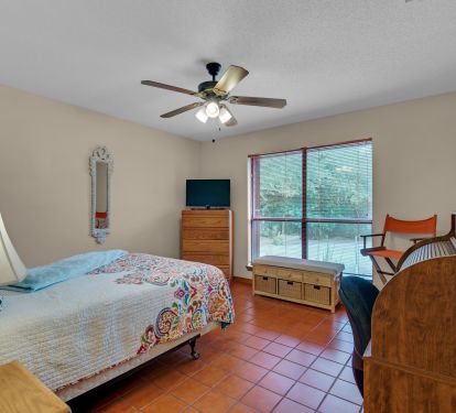 Front bedroom with Queen bed and large closet &amp; roll top desk