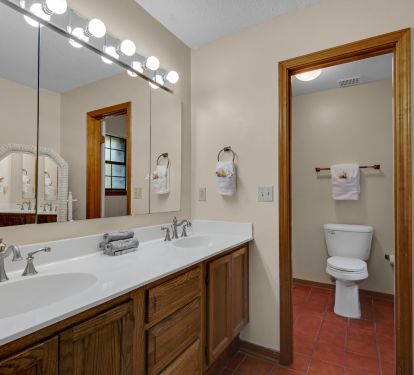 Master bath has a tub and shower combination