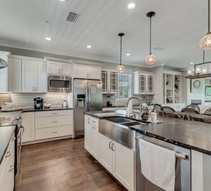 Large Kitchen stocked with plenty of dishes and cookware 