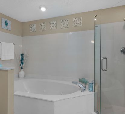Master Bathroom has double sink vanities, jacuzzi tub and walk in shower