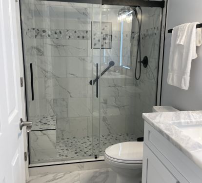 Newly remodeled second bathroom features walk-in shower. 