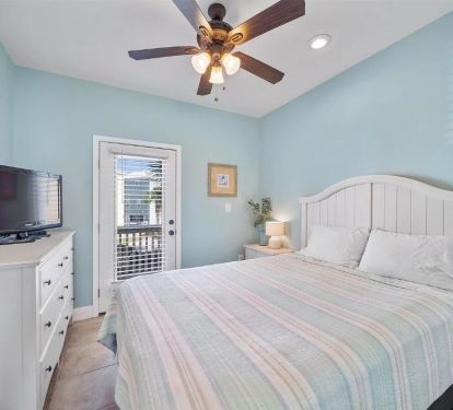 Main Floor Queen Bed with balcony, smart TV and view of pool