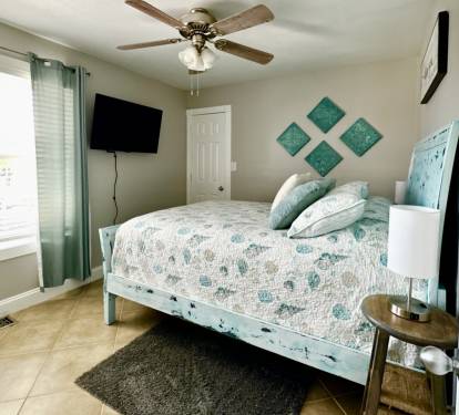 Main Floor Guest Bedroom-Queen Size Bed with Walk In Closet
