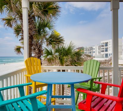 Wraparound deck with high top table and chairs for outdoor dining