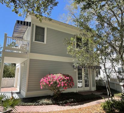 Carriage House with front porch and balcony
