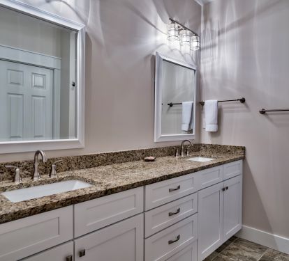 2nd Floor Master Suite Bathroom with double vanities and a walk-in shower
