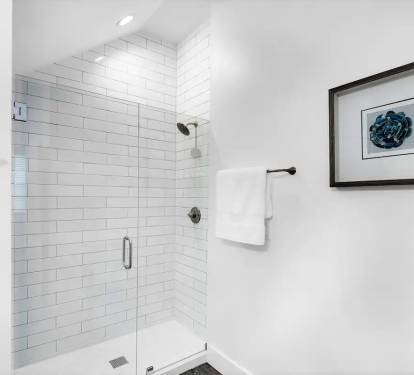 Bliss-19 1st Floor. Bedroom 1. Private Bath Picture 2. Private bath with frameless glass walk-in shower.