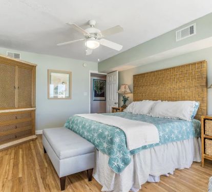 Upper king main bedroom with TV armoire and dresser drawers