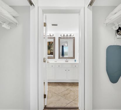 Master bedroom closets and entry door to Master bathroom.