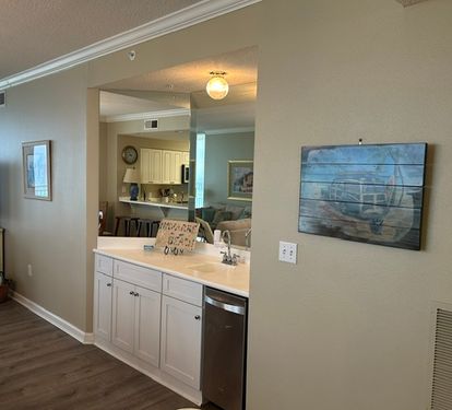 Wet bar across from dining - ice maker and sink