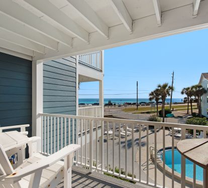 Balcony with Adirondack tall chairs and table