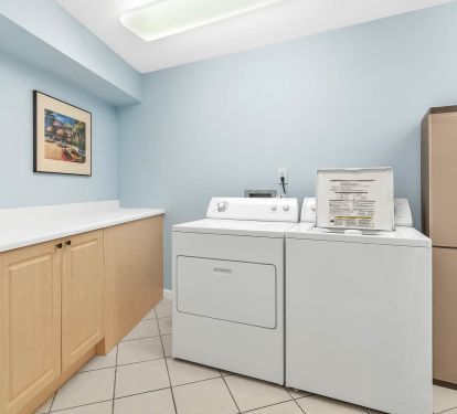 large laundry room with storage space!