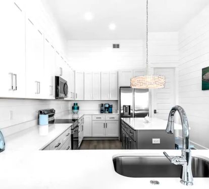 Horizon-16 Create your culinary masterpieces in Horizon's new kitchen, featuring stainless appliances with quartz counters.