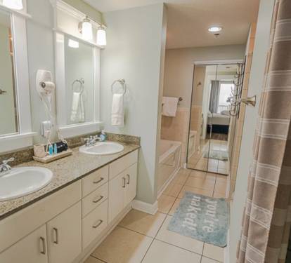 Master bath with tub, shower, and double sink vanity