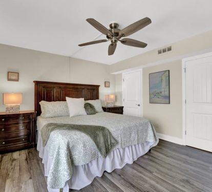 This master bedroom features a walk-in closet and a bathroom. 