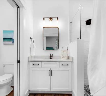 Latitude-15 1st floor. Bed 1 bath, photo 1. King master suite with frameless glass, tiled shower and quartz vanity.