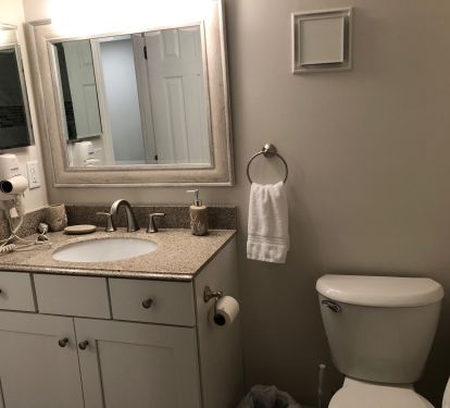 The hall bath has a shower/tub combo.  Both baths have a hair dryer.