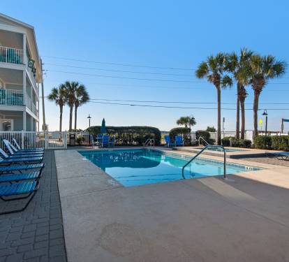 Heated pool with railing for walk down