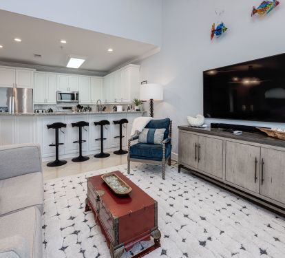 Open living area with bar seating&mdash;perfect for gathering and relaxing.
