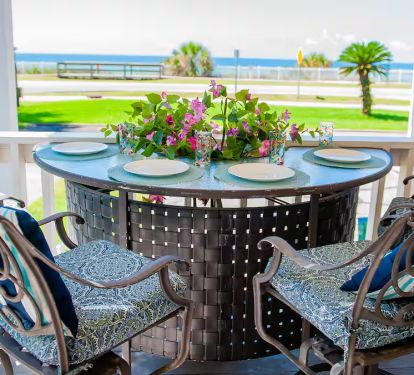 Beautiful space on front porch to enjoy breakfast or dinner...Great breeze being on the corner unit