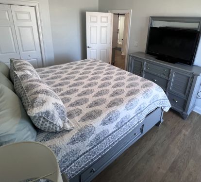 Bedroom 3 -King Bed 55" Smart TV with balcony access, new flooring