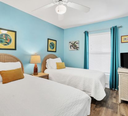 Second bedroom with two twin beds.